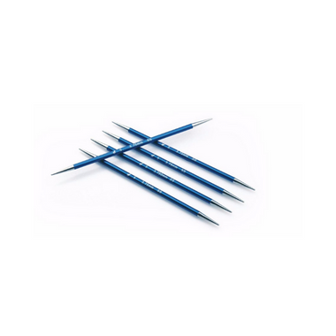 4 blue double pointed knitting needles lying vertically with 1 blue double pointed knitting needle crossing them horizontally.